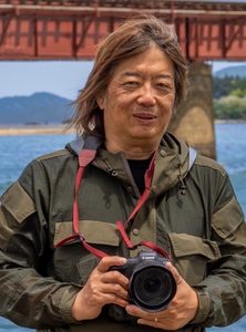 〔松本洋一氏〕