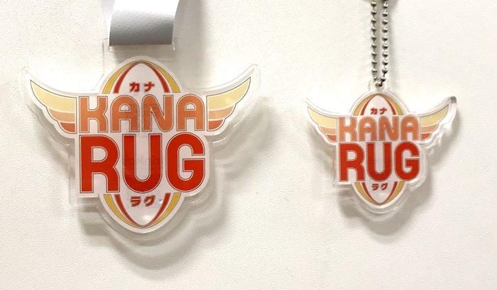 「KANARUG」のイベントロゴのデザインを施したノベルティグッズ