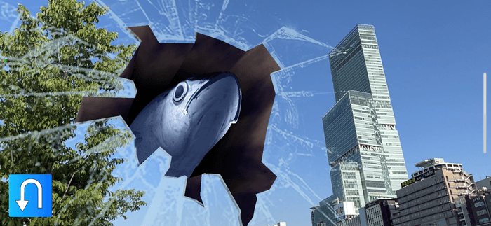 マスクに搭載したAR機能によって撮影できるあべのハルカス付近から飛び出すマグロ