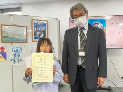 下神納木彩乃さん（左）と当社社員代表として管理部大友康智（右）