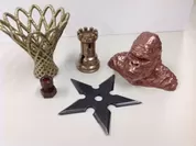 3Dプリンターで出力した造形物(フィラメント)にメタルコーティング（左から真鍮・ブロンズ・鉄・銅)