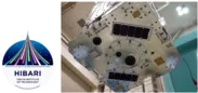 図3：（左）革新的衛星技術実証2号機テーママーク （右）衛星組み上げ後のUVCAM（ロケットIFと 接続される円形構造の内側、左側の赤いレンズがUVCAM 最終振動試験＠JAXA筑波宇宙センター）