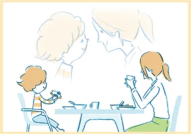 朝食を向き合って食べる親子