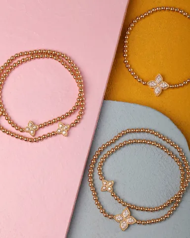 〈プリンセスフラワー〉3点全てストレッチバングル 左：2連タイプ。K18YG/WG・ダイヤモンド。￥825,000(税込)  右上：K18YG/WG・ダイヤモンド。￥583,000(税込)  右下：2連タイプ。K18YG/WG・ダイヤモンド。￥880,000(税込)