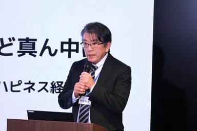 NTTインテグレーション株式会社 グループ経営本部長 鎌田 晃治　登壇の様子