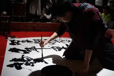 生徒代表席上揮毫