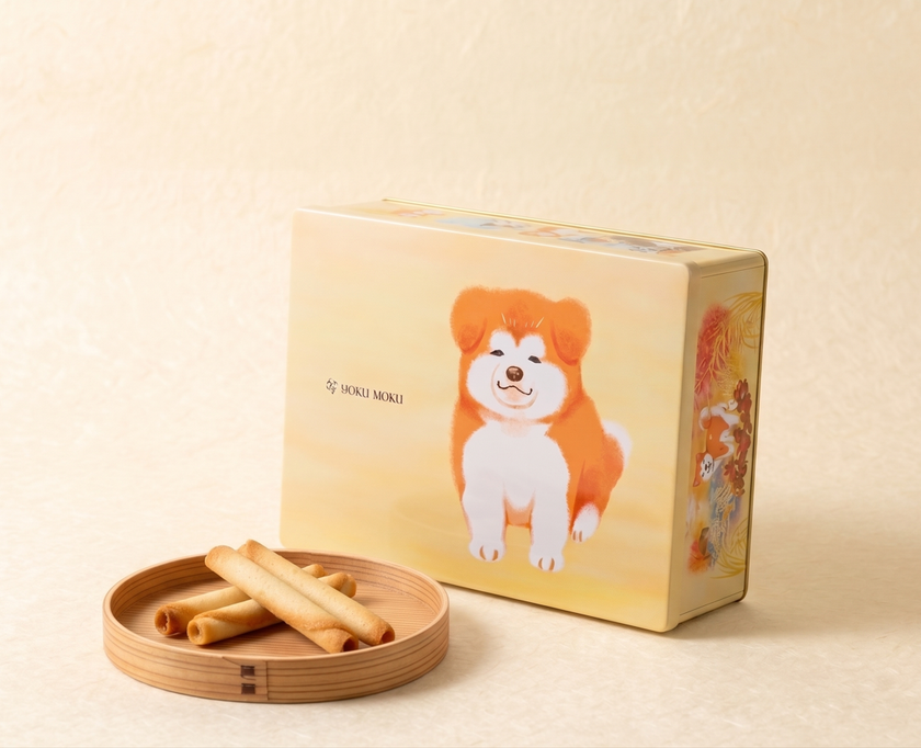 【令和8年8月8日】トリプル「8」の日に発表！
ヨックモック・地域バージョンの秋田デザイン缶が誕生
～かわいい秋田犬の子犬と秋田の四季と名所を巡るパッケージ～
9月1日(火)秋田県内で販売開始
